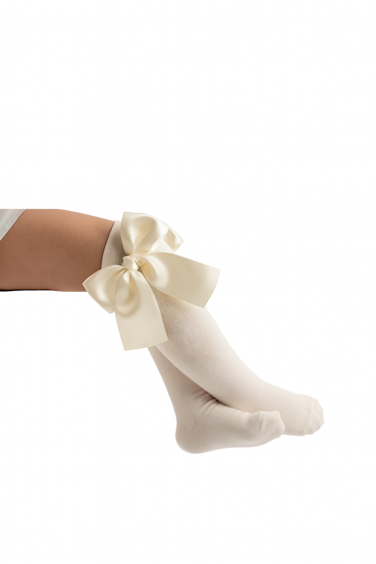 Ivory Knee socks with a large bow on a white background