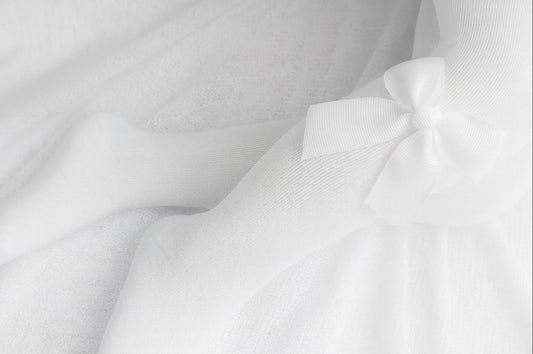 Close-up of white fabric with folds