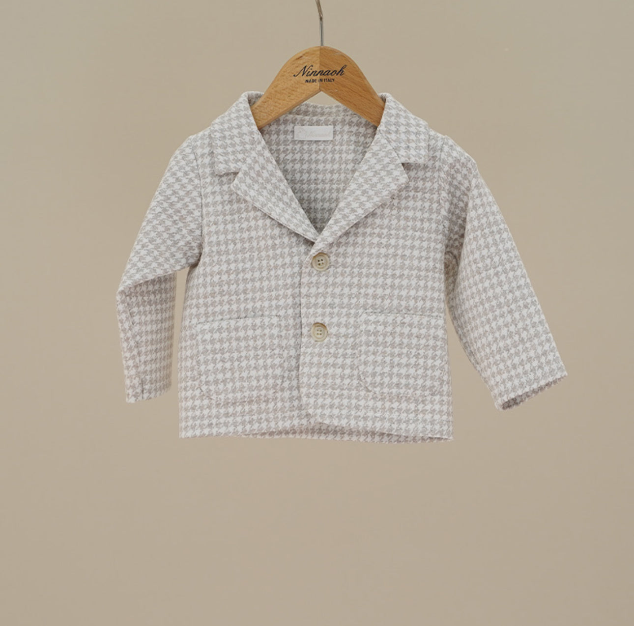Shop our Baby Houndstooth Blazer Jacket, a timeless neutral piece for boys and girls. Classic design, Italian-made quality. Matching dresses, coats, hats & booties available.