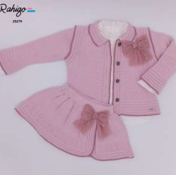 Two-piece ensemble: knit cardigan with button front and matching skirt.