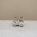 Soft brushed cotton baby booties in beige &amp; cream houndstooth. Matches outfits, hats, and coats from the Dino Collection. Sizes 3–12M.