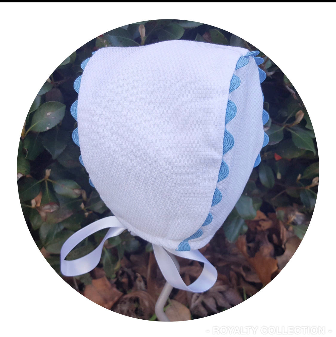 White Cotton pique baby bonnet with Baby Blue Zig Zagged Trim